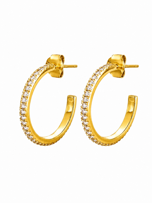 A pair of gold hoop earrings with a row of small clear stones along the front, shown on a plain white background.