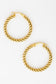 Pair of gold hoop earrings on a white background