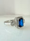 Sterling Silver Sapphire-Blue Rectangle Ring with Zircon Halo & Side Stones