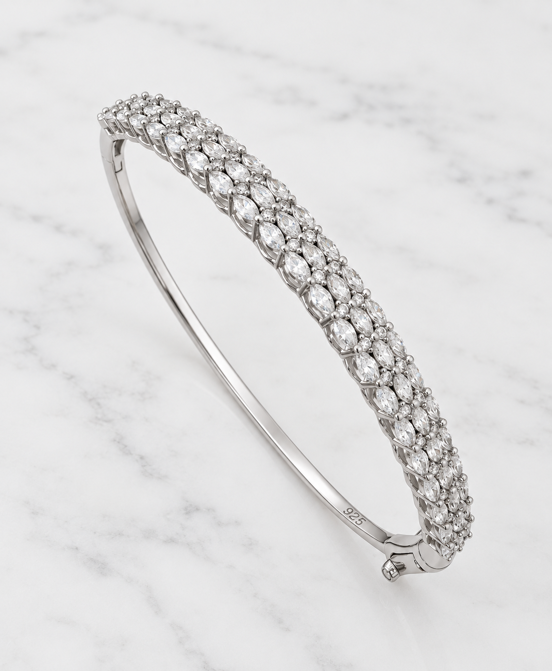 Sterling silver zirconia bangle on white marble