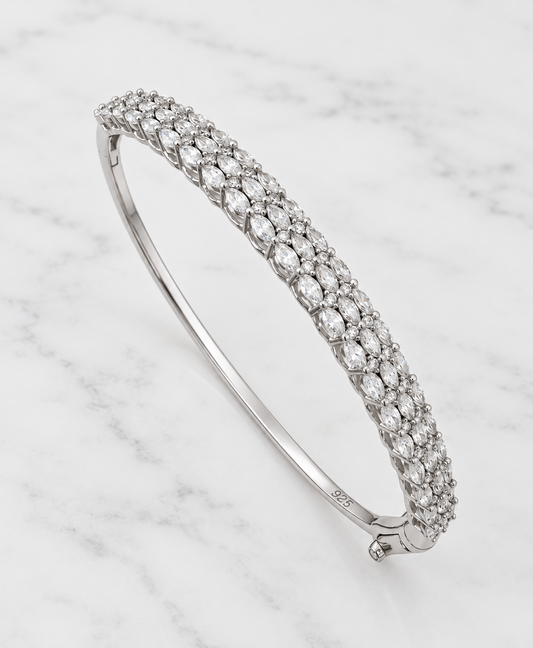 Sterling silver zirconia bangle on white marble